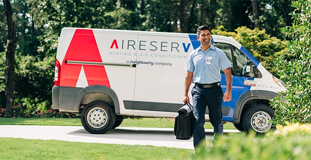 Aire Serv technician arriving for thermostat repair.