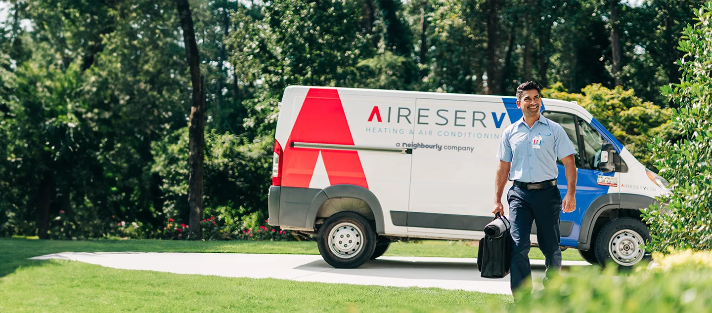 Aire Serv van parked at a customer's home.