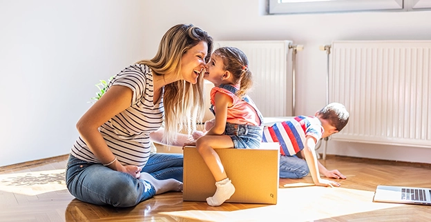 Mother playing with her children.