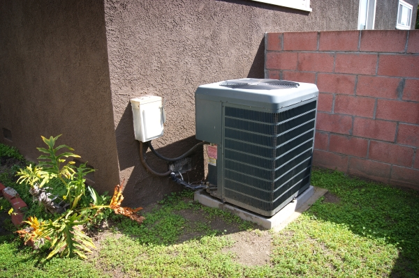 AC unit in the backyard of a residential home