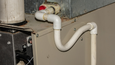 AC drain line in basement of a residential home