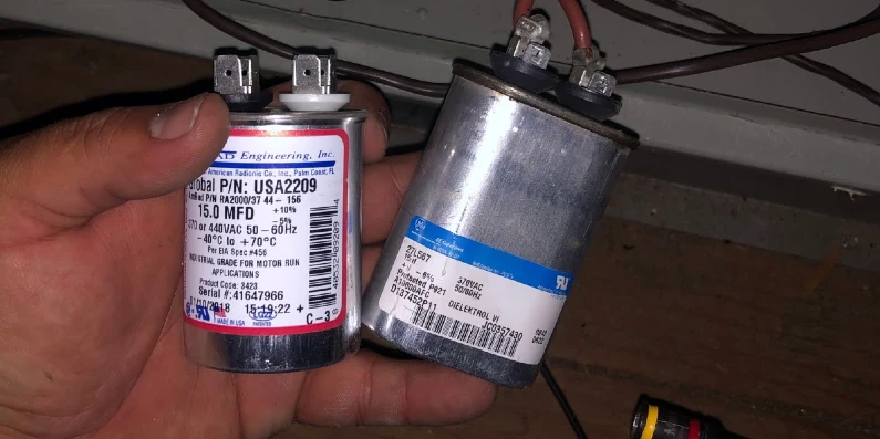 Aire Serv HVAC professional replacing and old AC capacitor with a new one