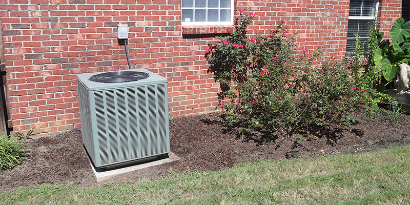 Large outdoor HVAC unit on concrete condenser pad.