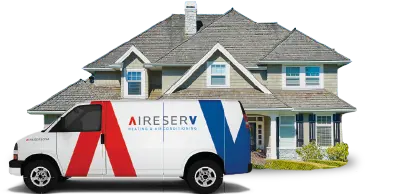 Aire Serv branded van in front of residential home with gray roof.